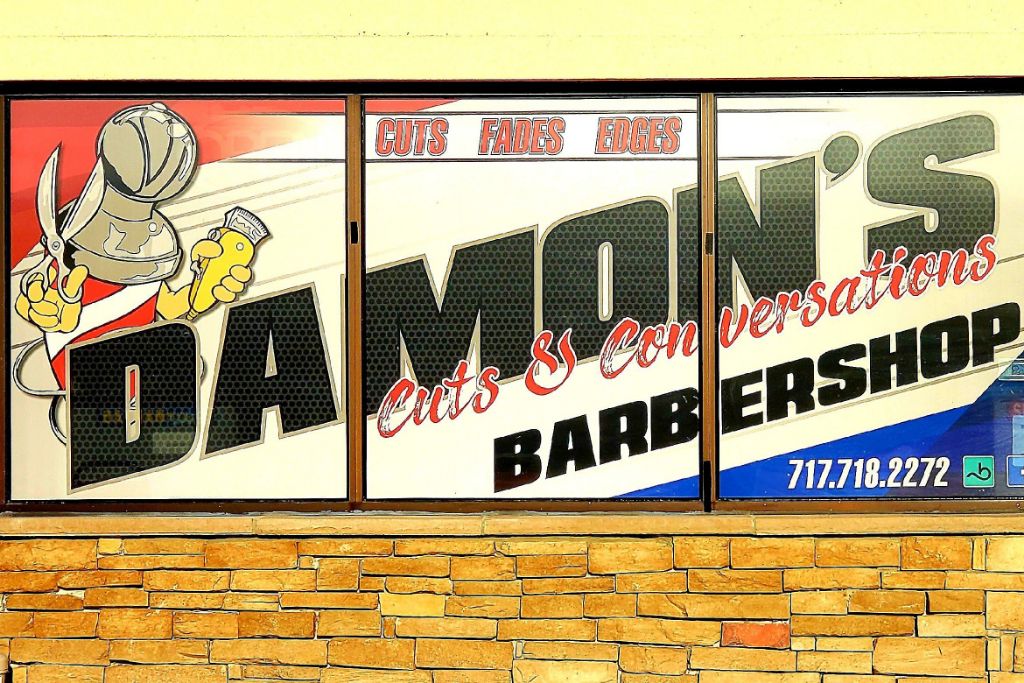 Damon's Cuts window sign — Cuts Fades Edges